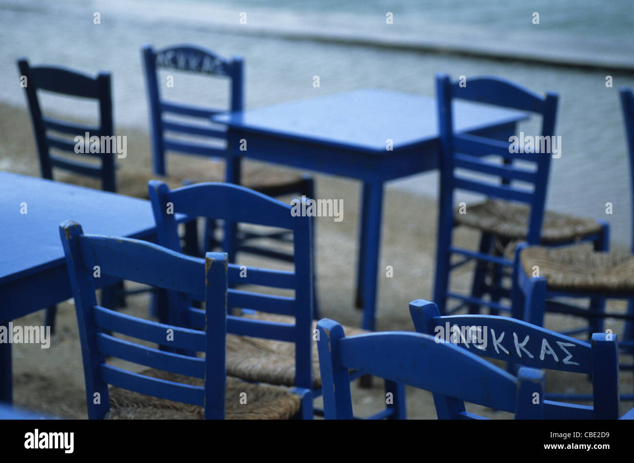 Empty chairs outside a restaurant, Aegina Island, Greece Stock Photo