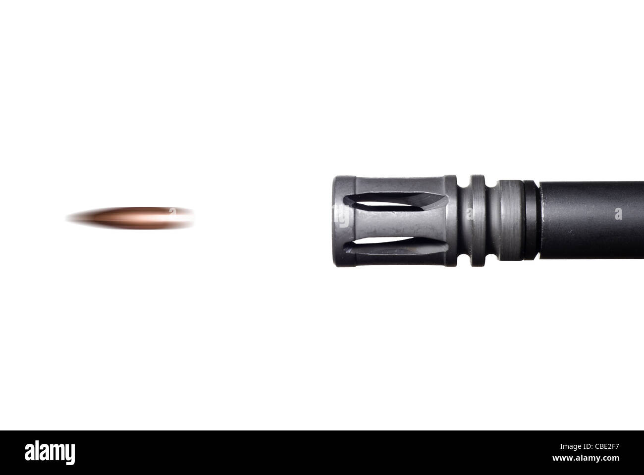 A bullet leaves the barrel of an AR-15 rifle. Stock Photo