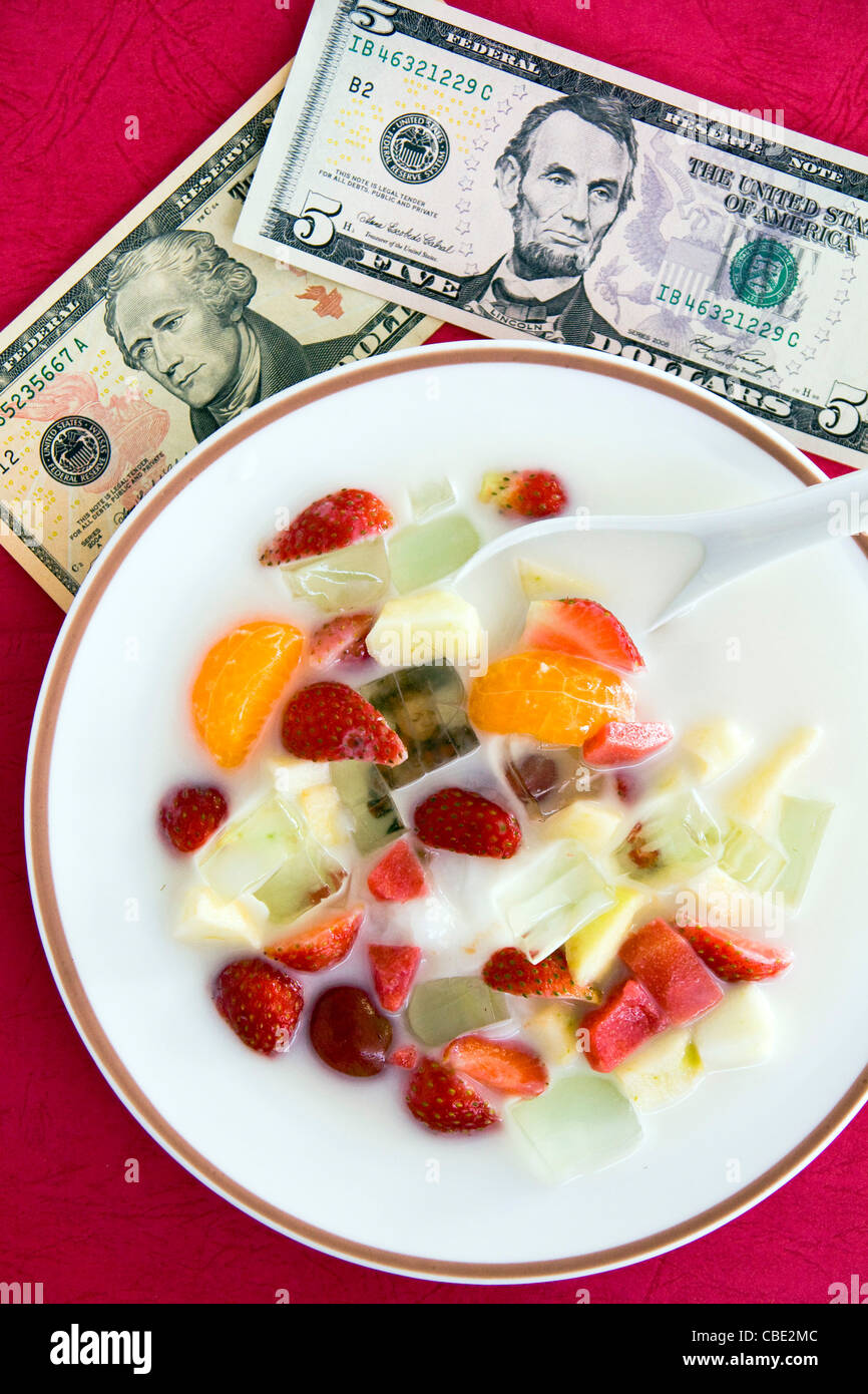 Delicious fresh fruit platter and us dollar Stock Photo