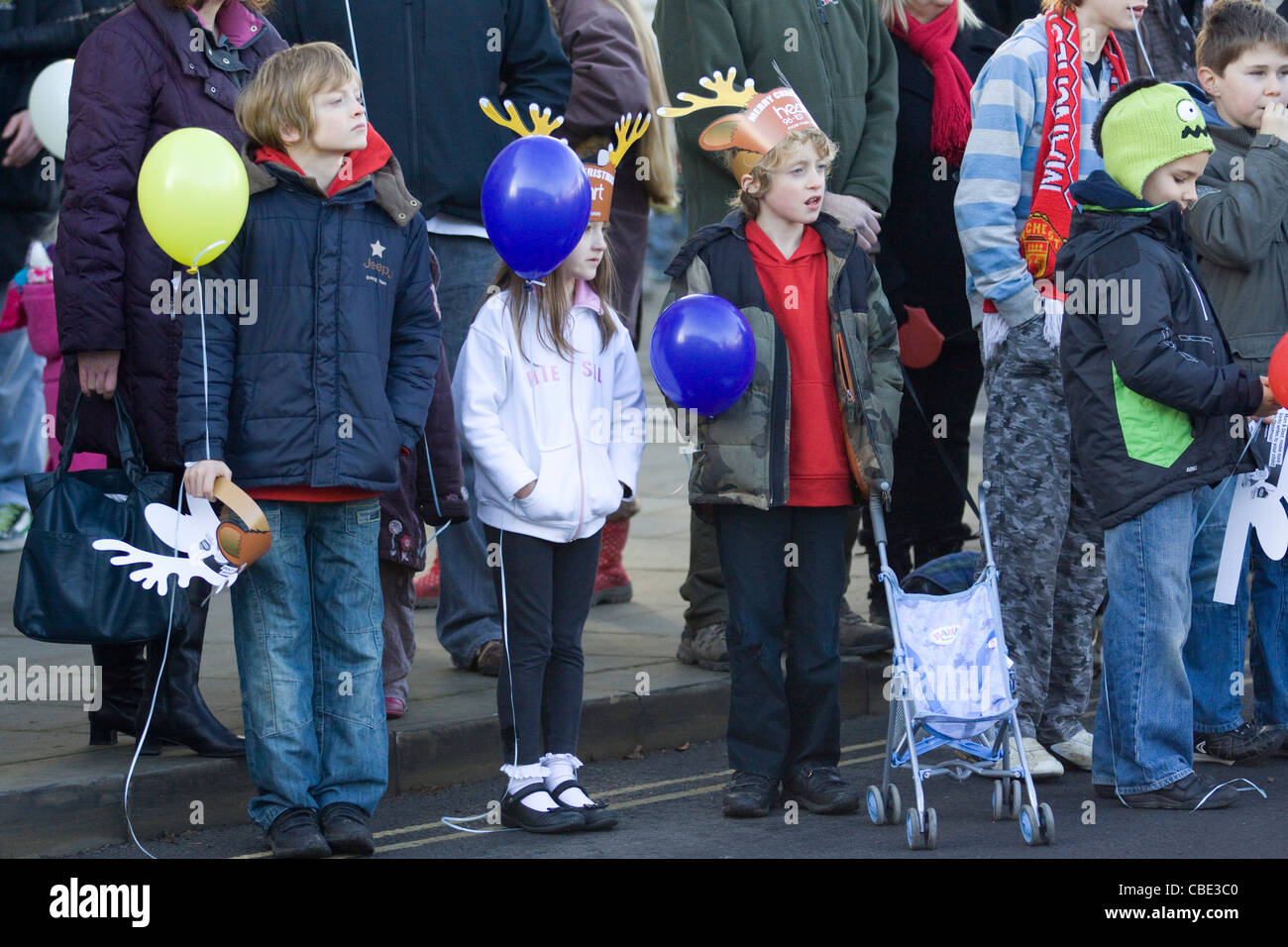 Crowds of People watching the Christmas Day Parade in Buckingham Stock