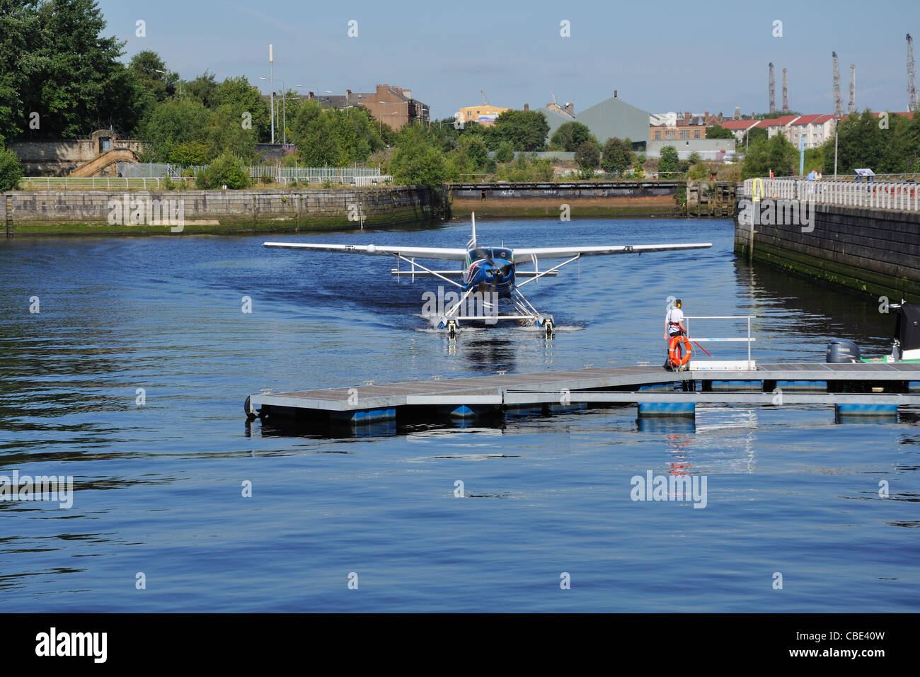 Seaplane arrives back at Glasgow science centre. Stock Photo