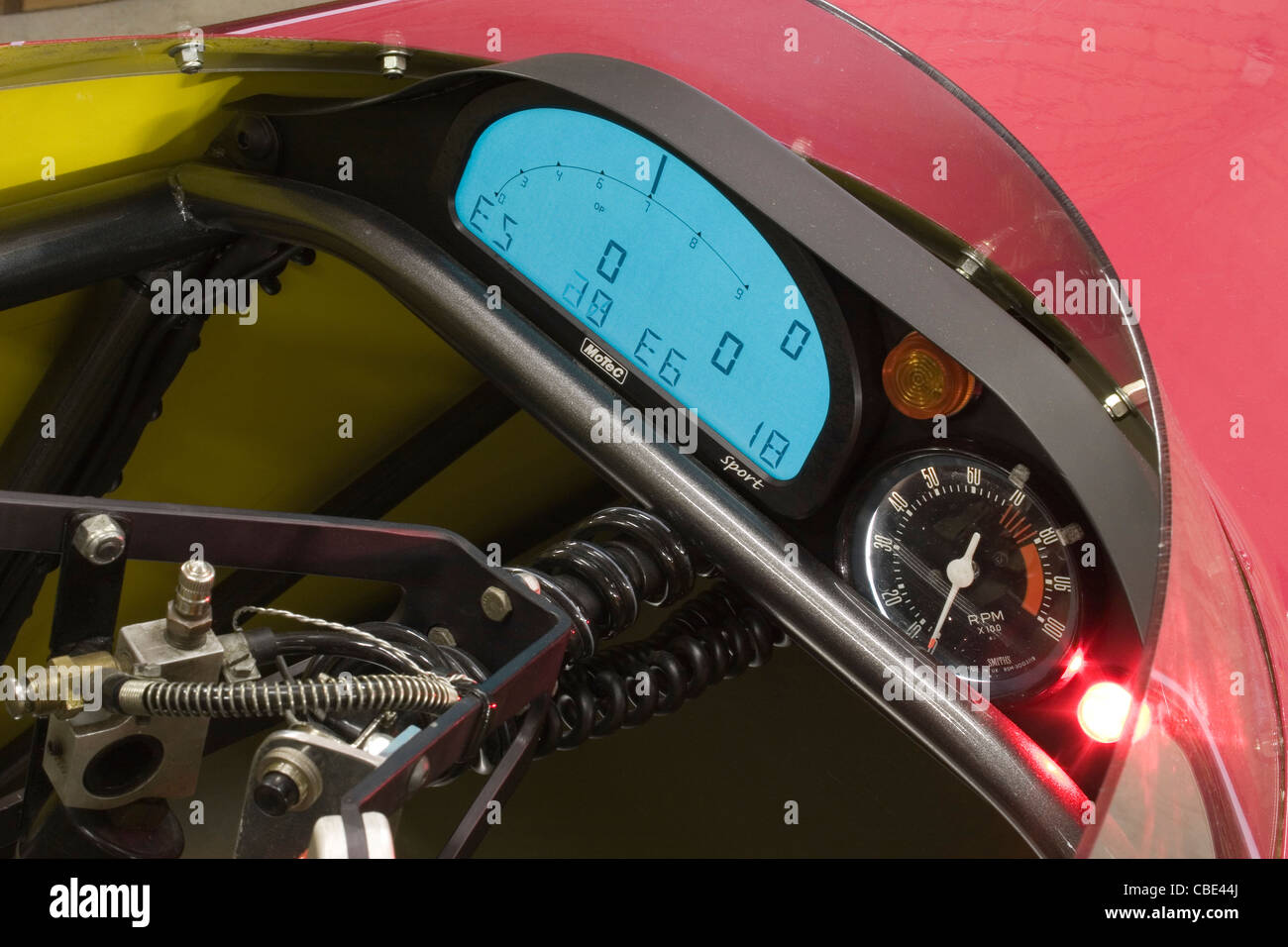 Digital LCD dash with tachometer readout in the cockpit of a drag