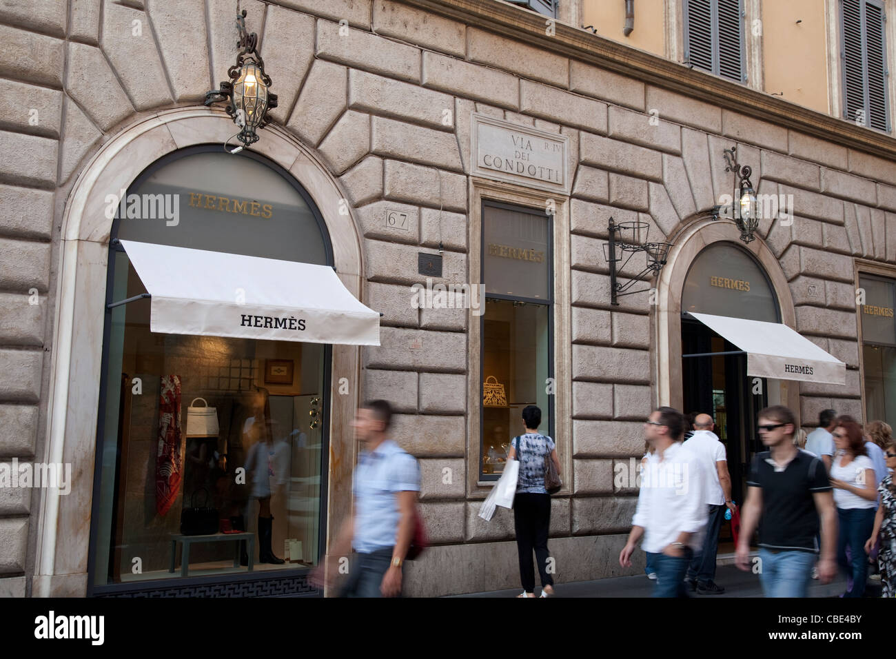 Shoppers walking pass Hermes Shop; Via dei Condotti; Rome, Italy Stock  Photo - Alamy