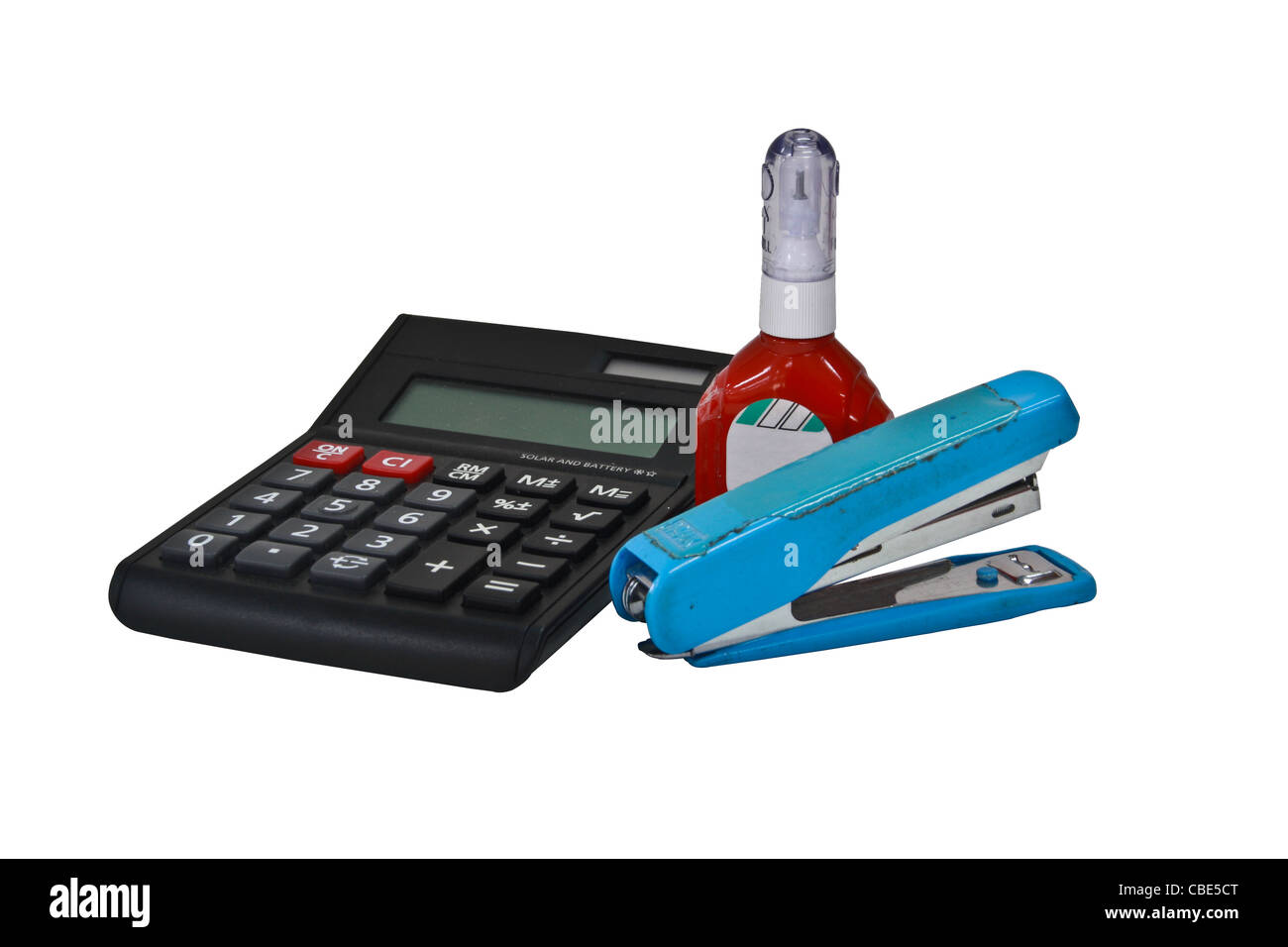 Office equipment. Calculator, a stapler and a liquid. clipping path inside Stock Photo