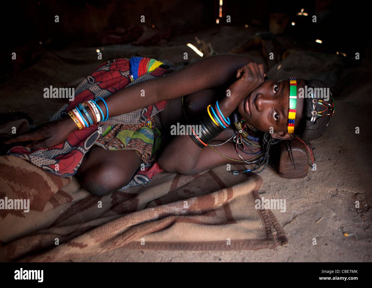 Mucawana Girl Laying On A Headrest, Village Of Mahine, Angola Stock Photo
