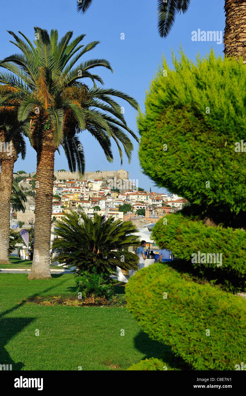 The ottoman citadel of Kavala as seen from the palm trees of the port. Kavala; Macedonia, Greece. Stock Photo
