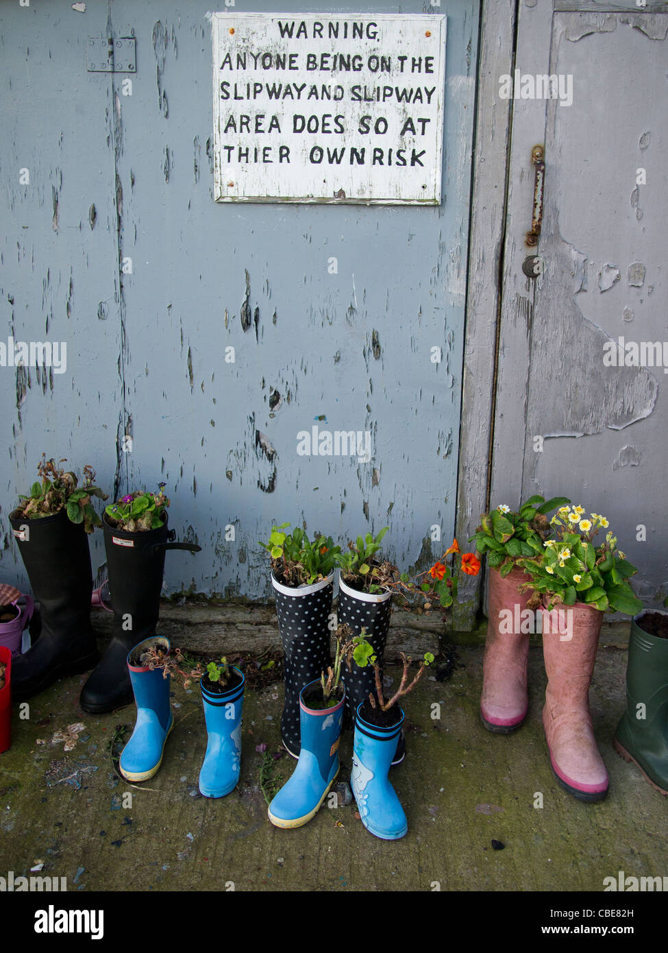 Planted flowers in boots hi-res stock photography and images - Alamy