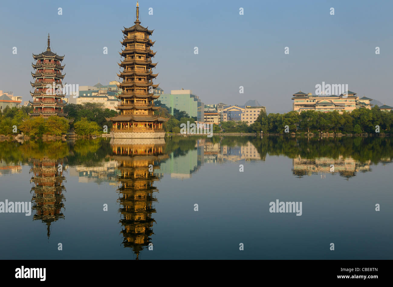 Sun and Moon Pagodas reflected in Shanhu or Fir Lake in early morning in Guilin Peoples Republic of China Stock Photo
