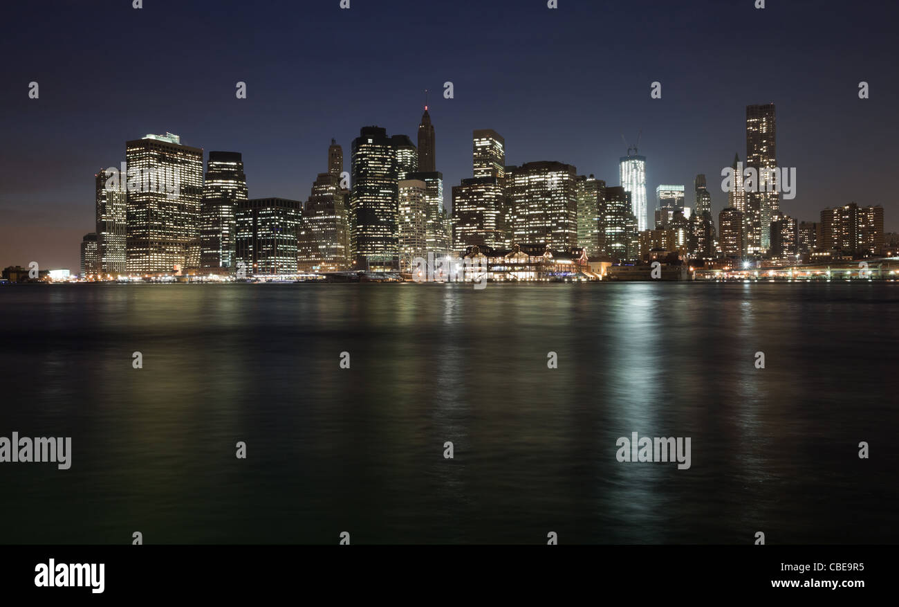 The New York City skyline at twilight w the Freedom tower Stock Photo ...