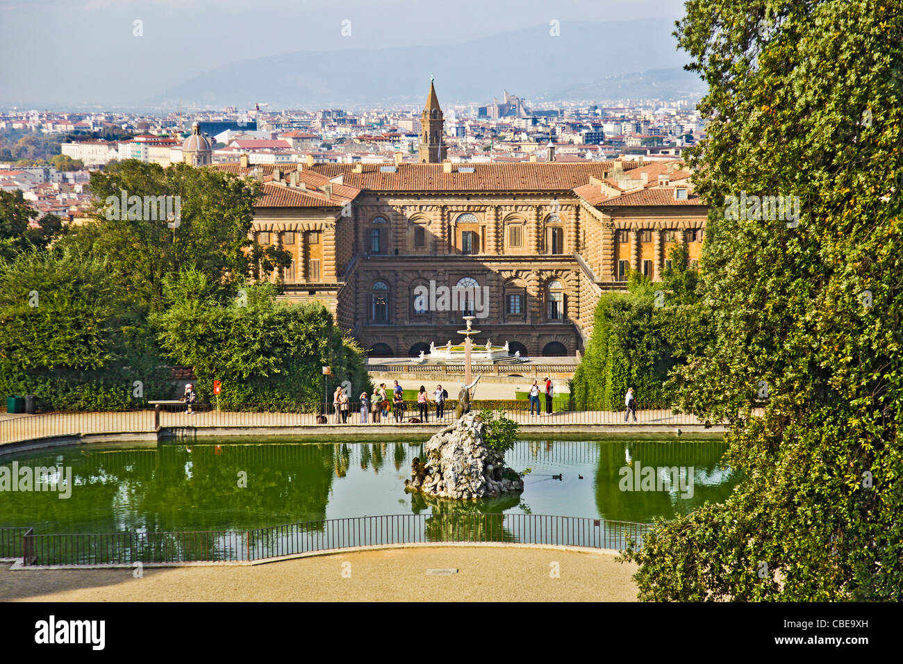Looking down at the fountain and lake at the rear of Pitti Palace, with Florence behind, from the Boboli gardens. Stock Photo