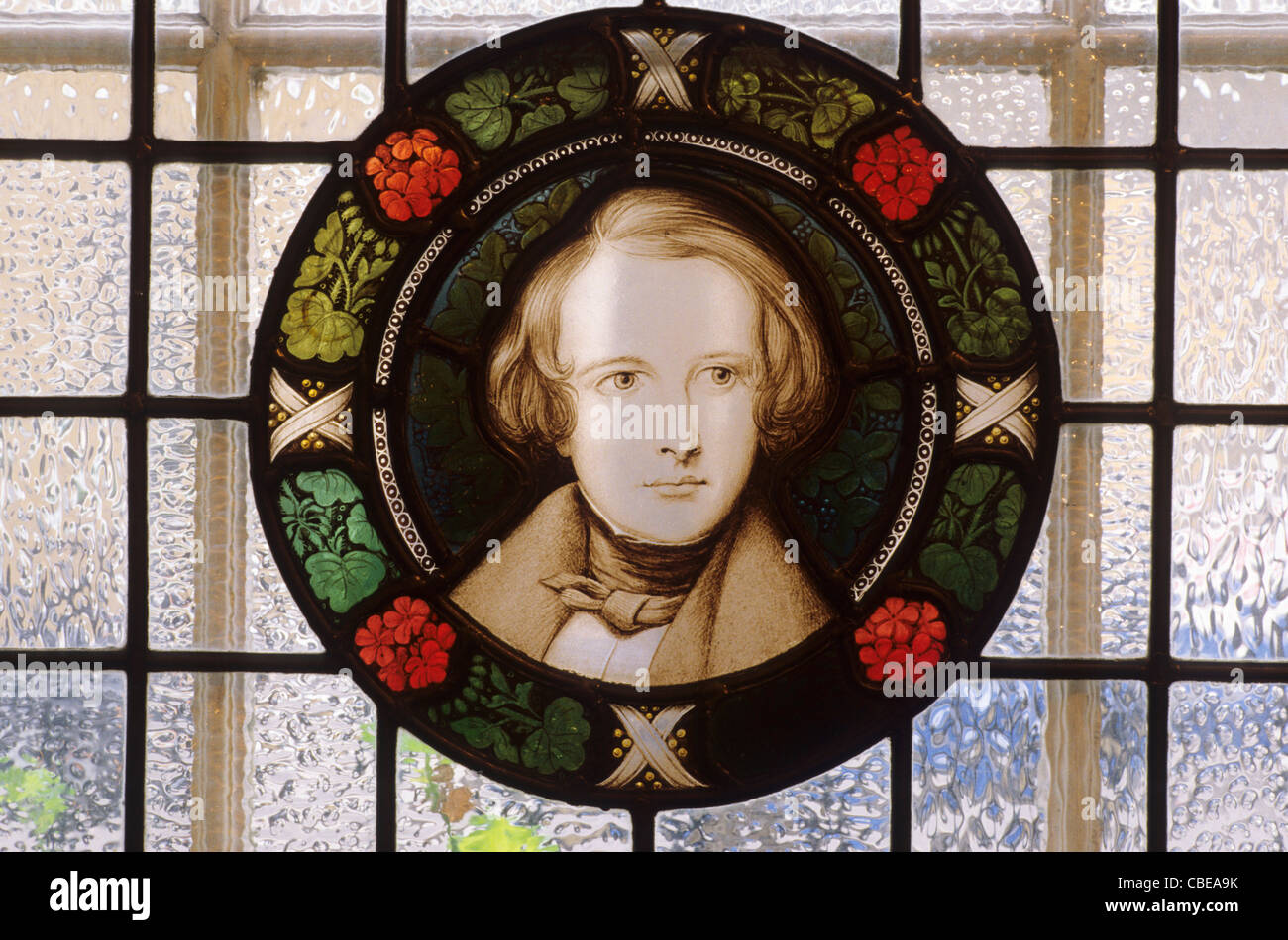 Dickens portrait, stained glass roudel, Dickens House, Doughty Street, London, Young man portraits window windows Stock Photo