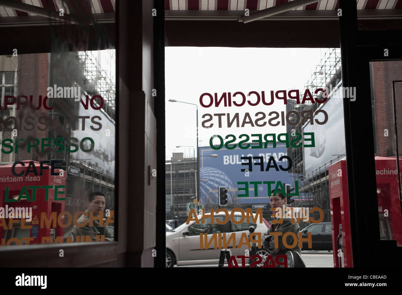 East end Cafe London, view to street through window showing passing