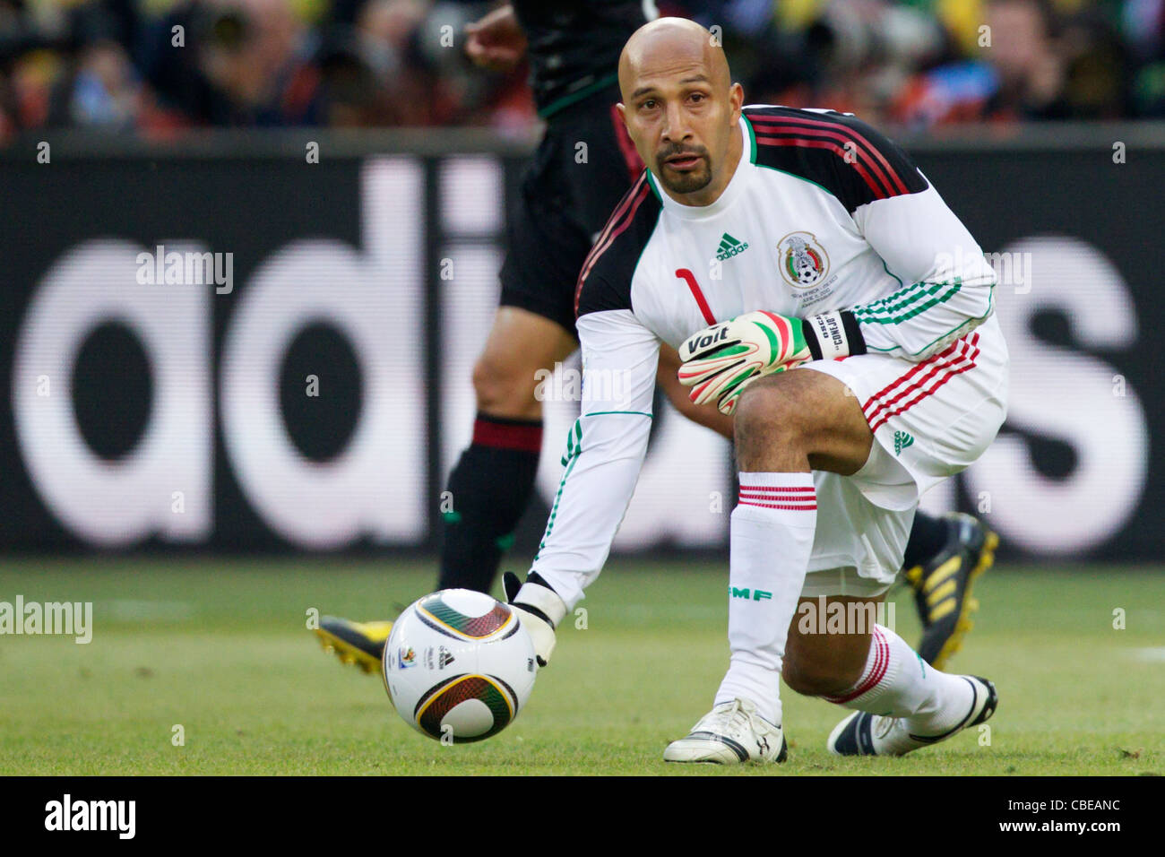 Mexico goalkeeper Oscar Perez rolls the ball during the opening match of the 2010 FIFA World Cup against South Africa. Stock Photo