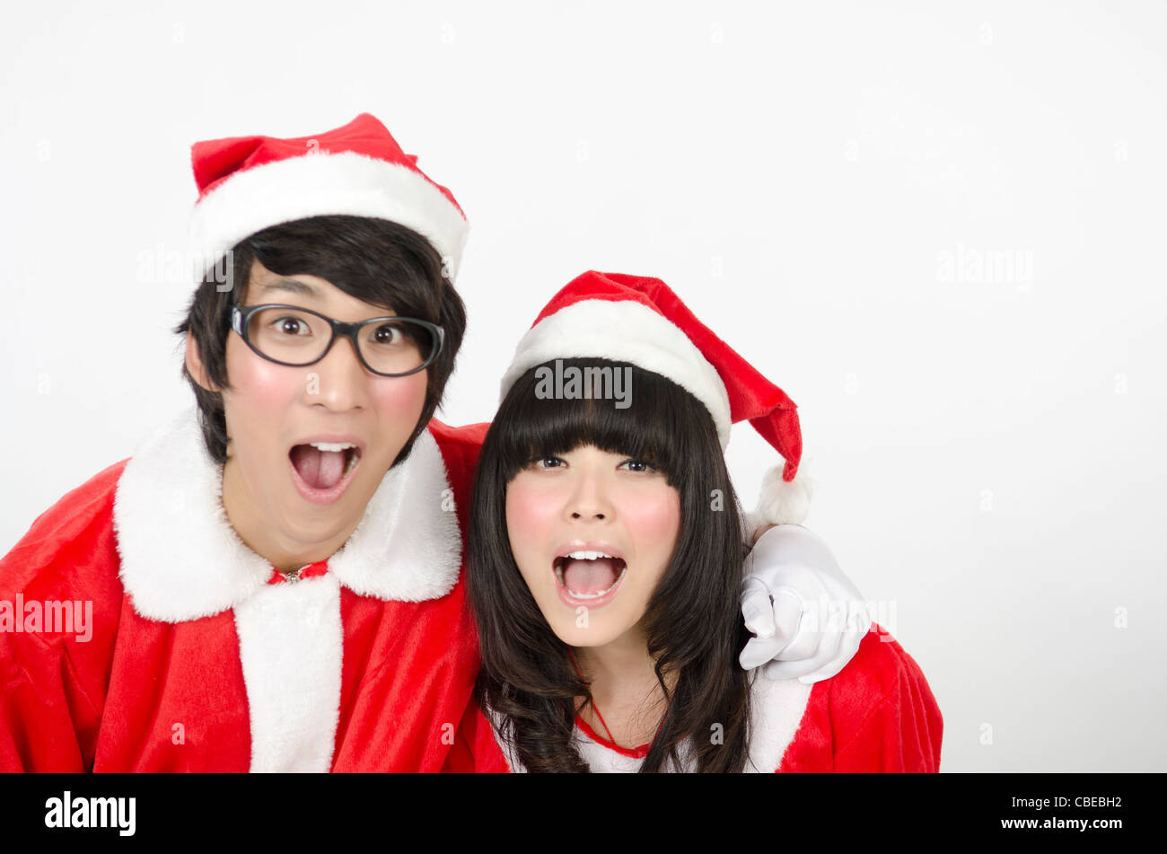 Asian Young Couple Happy With Christmas Coming Stock Photo