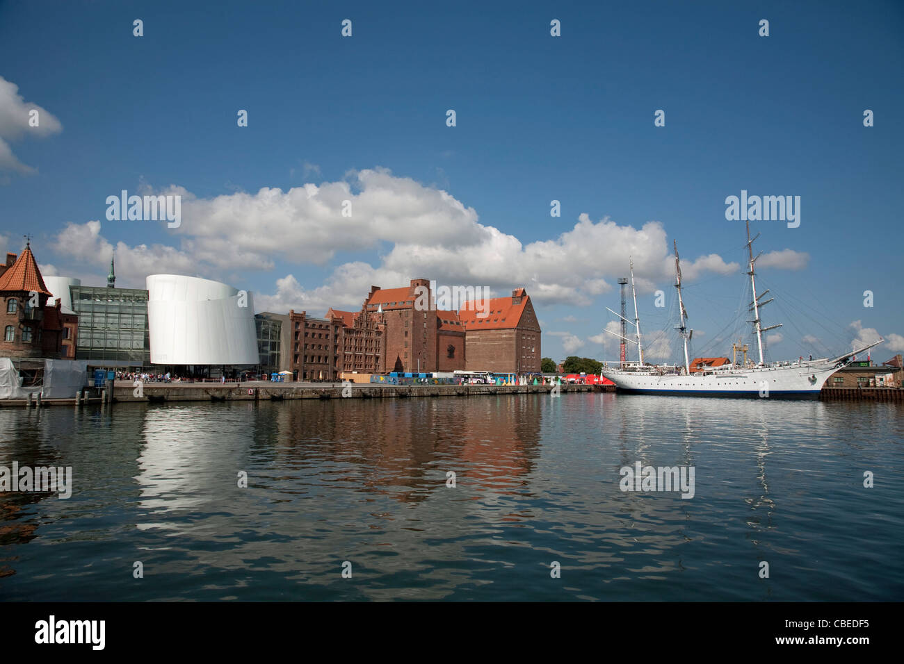 The port of Stralsund with the public aquarium Ozeaneum and the former German Reichsmarine Navy Sail Training ship Gorch Fock Stock Photo