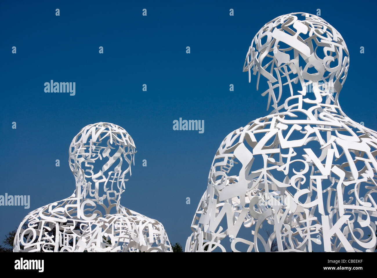 Jaume Plensa Sculpture, Two Seated Figures Formed from a Mesh of White Letters, Yorkshire Sculpture Park, UK Stock Photo