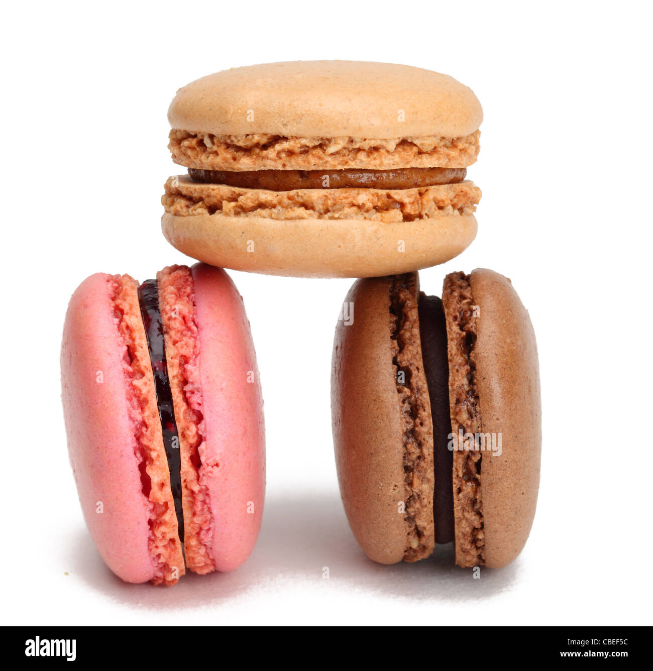 Three macaroons isolated against a white background. Stock Photo