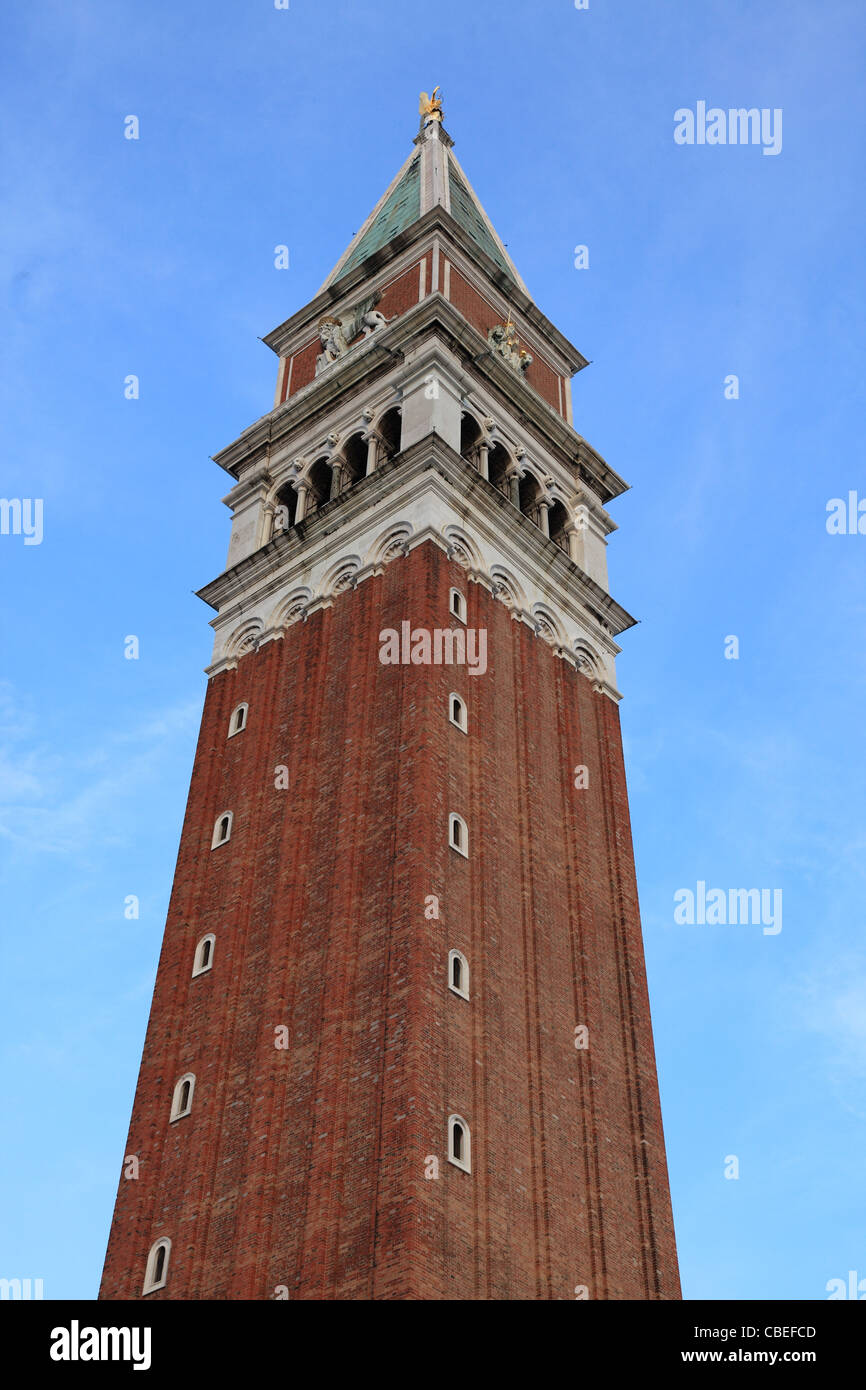 The upper part of St Mark's Campanile (Campanille di San Marco) locate din St. Marco square in front of the basilica. Stock Photo