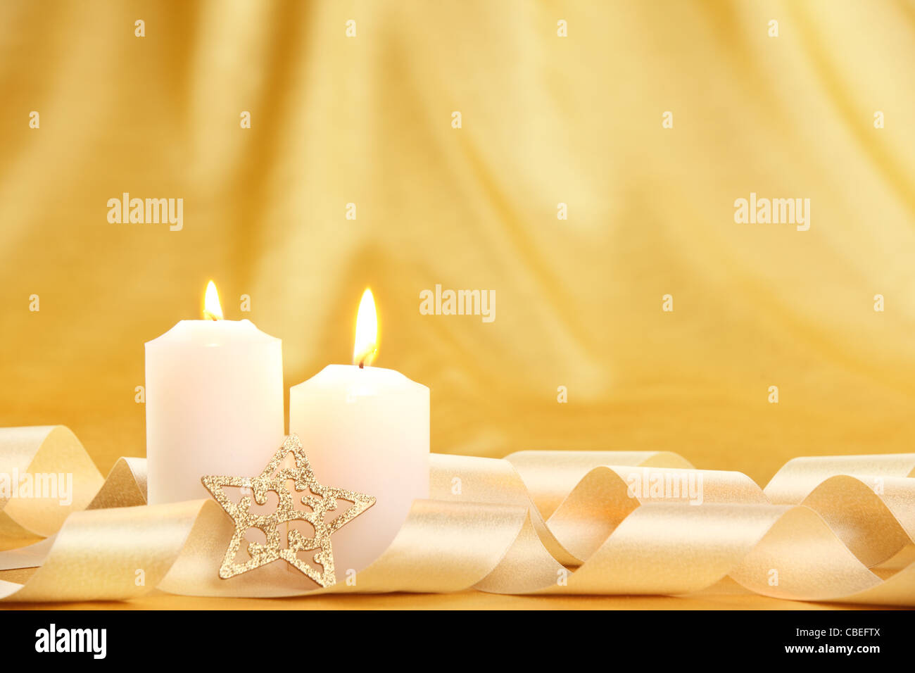 Christmas candles decorated with ribbon Stock Photo Alamy