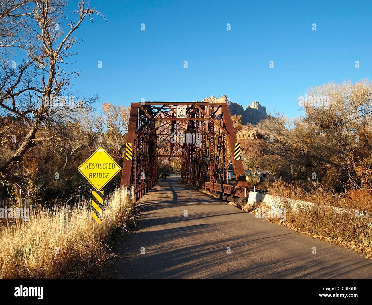 A one lane bridge over a western river. Stock Photo