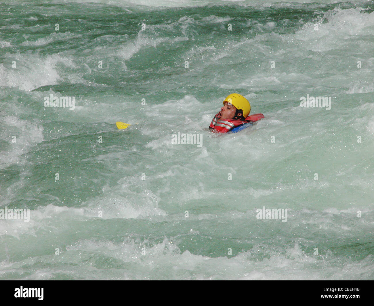 Man Fall Out Raft Man falls out raft and fights to stay above water Stock Photo - Alamy