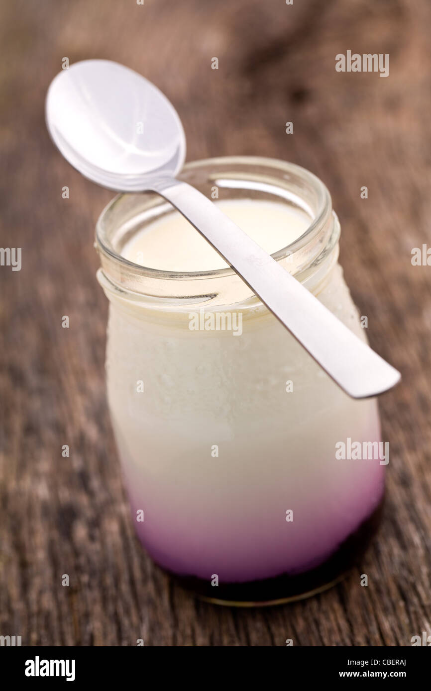 the white yogurt in glass jar Stock Photo