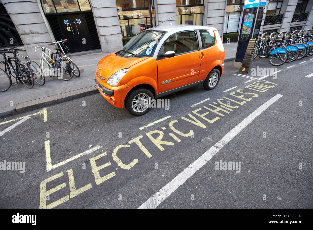 electric vehicles parking bay and car charging point london england uk united kingdom Stock Photo