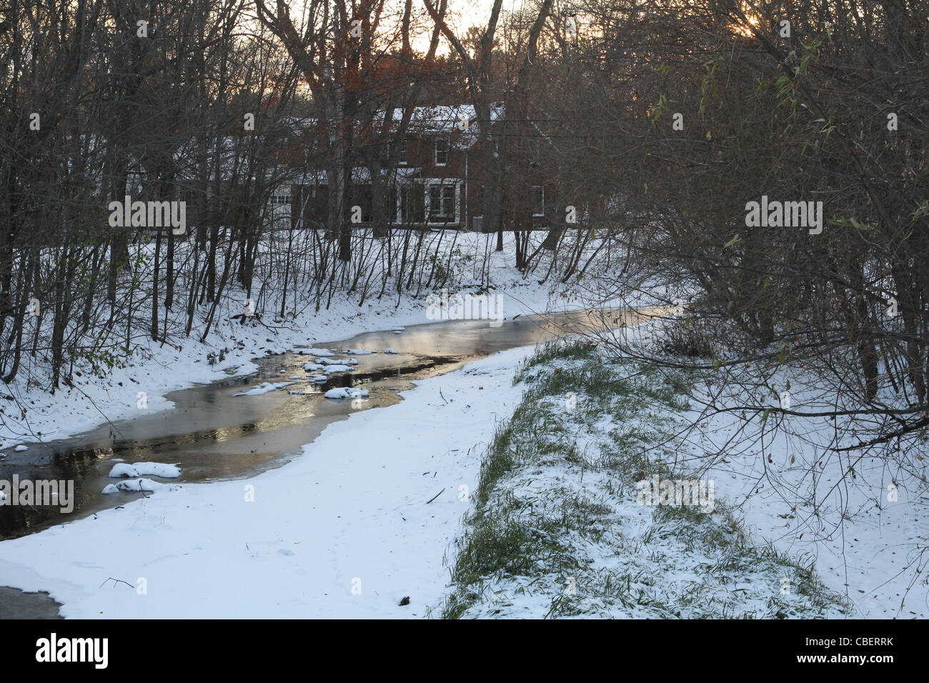 Minnehaha creek running through the city of Minneapolis, partially frozen. Stock Photo