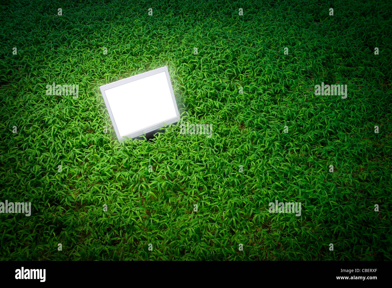 Computer Screen Outside In Grassy Field Stock Photo