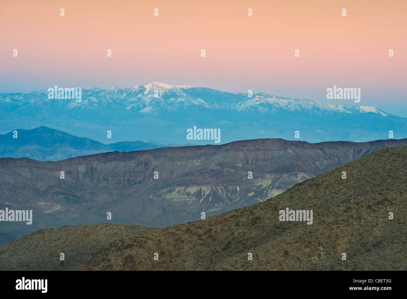 Sunset & Distant Snow Capped Mountains Of The Sierra Nevadas, California, USA Stock Photo