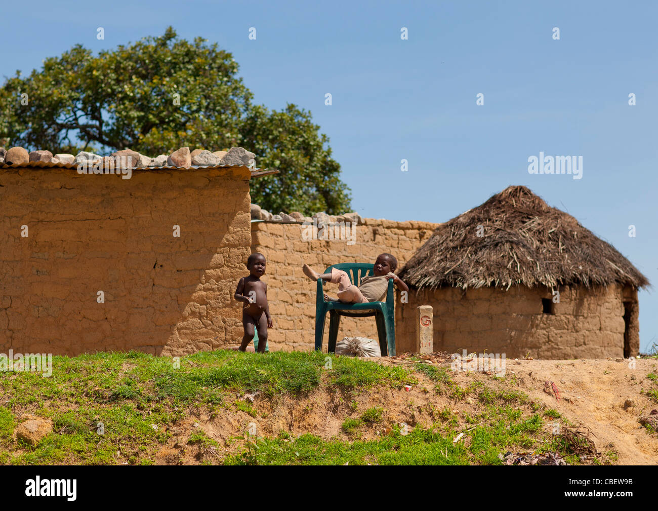 Kids Playing In Front Of Huts In Lubango, Angola Stock Photo