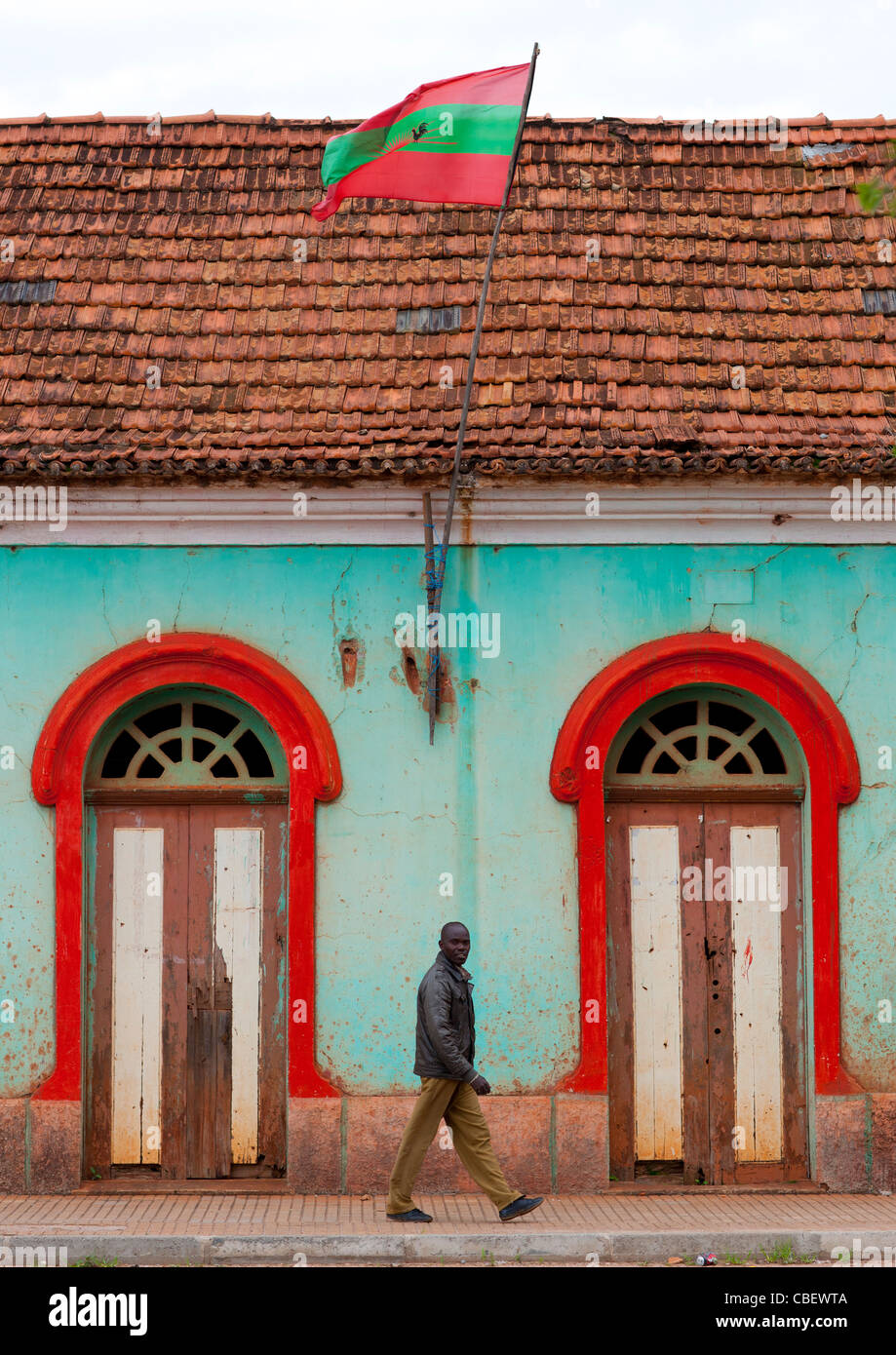Man Passing By UNITA Headquarters In Chinguar, Angola Stock Photo