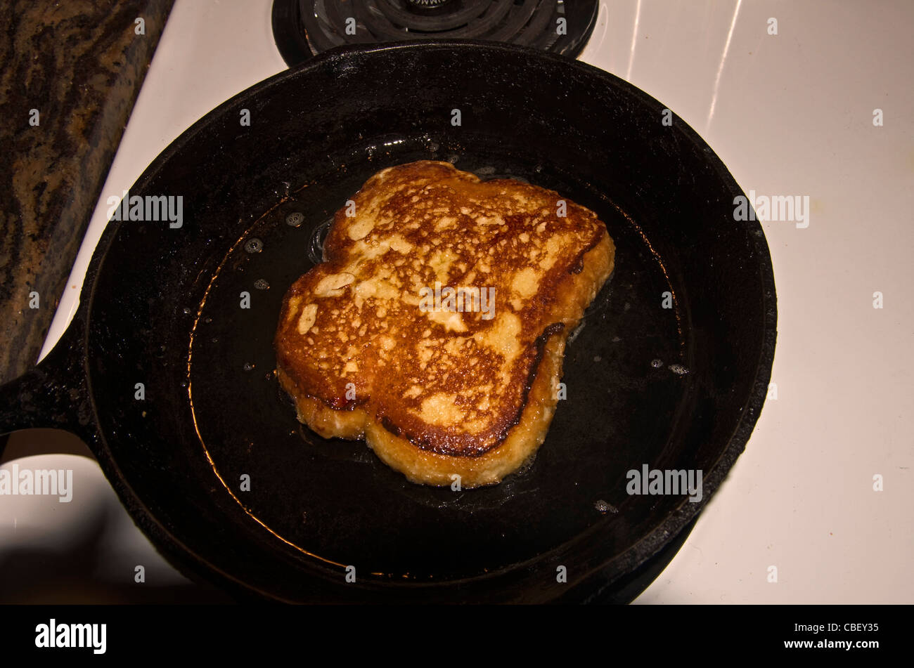 French Toast in a cast iron frying pan Stock Photo Alamy