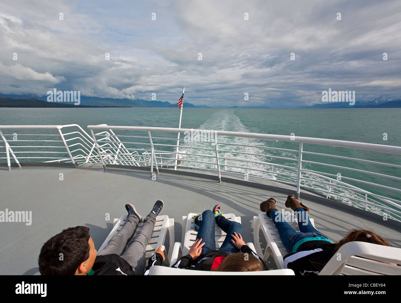 Passengers relaxing on the ferry deck. Alaska State ferry from Juneau