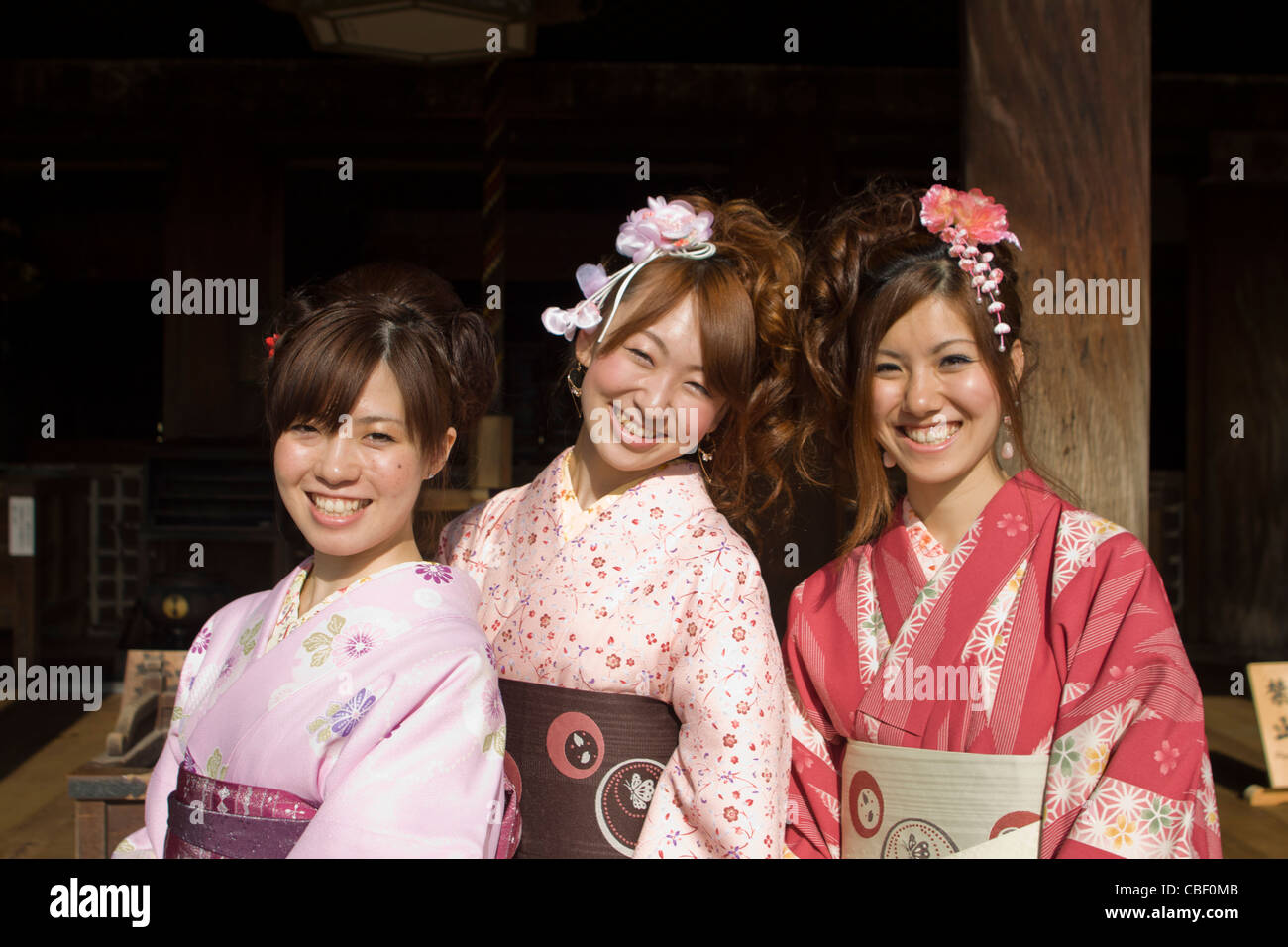 Three young Japanese girls in traditional clothing. Kyoto, Japan Stock Photo