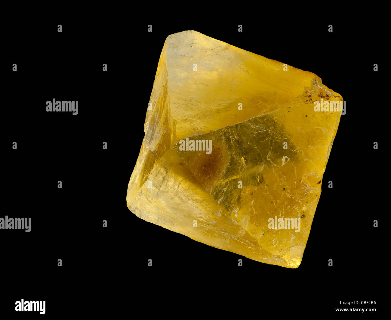 Cubic fluorite (CaF2) crystal isolated on black background Stock Photo