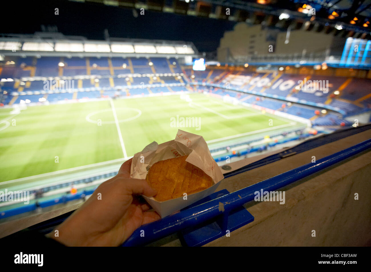 holding a pie at stamford bridge football ground home to chelsea fc london uk united kingdom Stock Photo