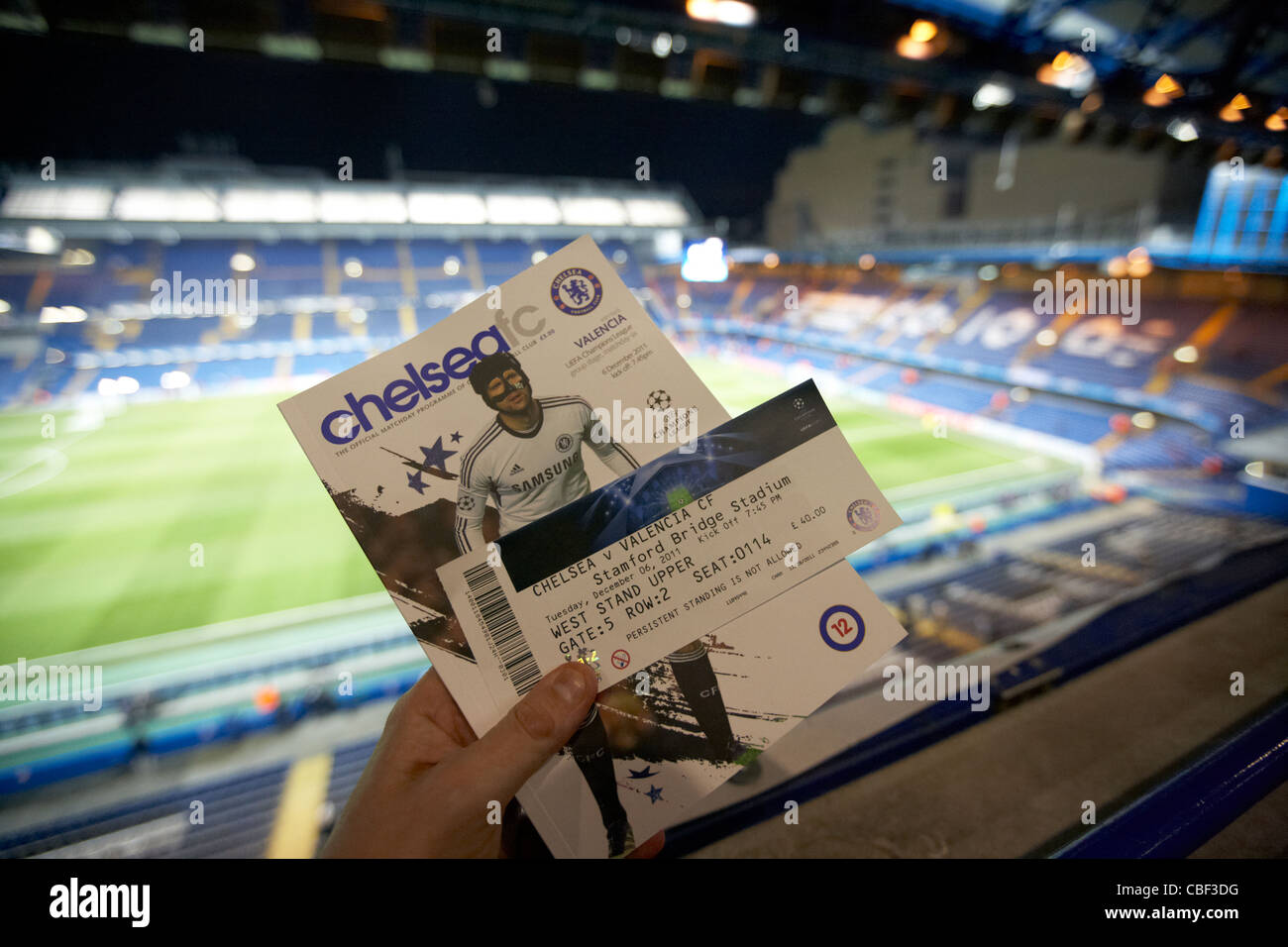 holding match ticket and programme at stamford bridge football ground home  to chelsea fc london uk united kingdom Stock Photo - Alamy
