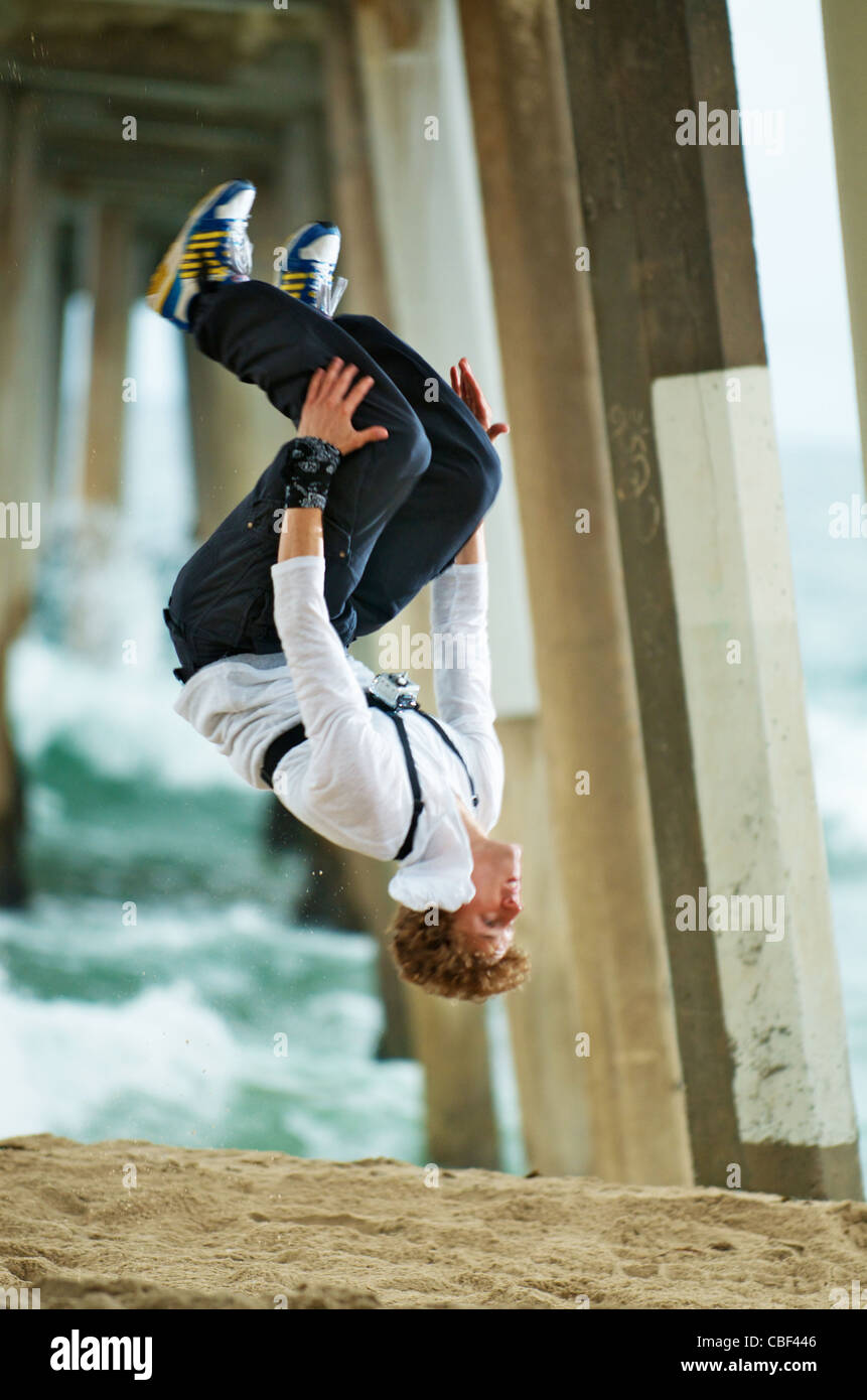 A parkour freerunning athlete doing a flip. Stock Photo