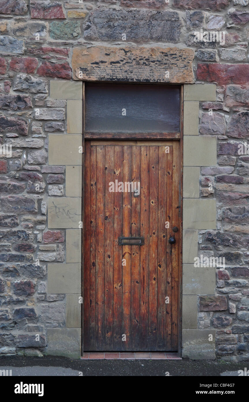 Old Wooden Door in Stone Building Stock Photo - Alamy