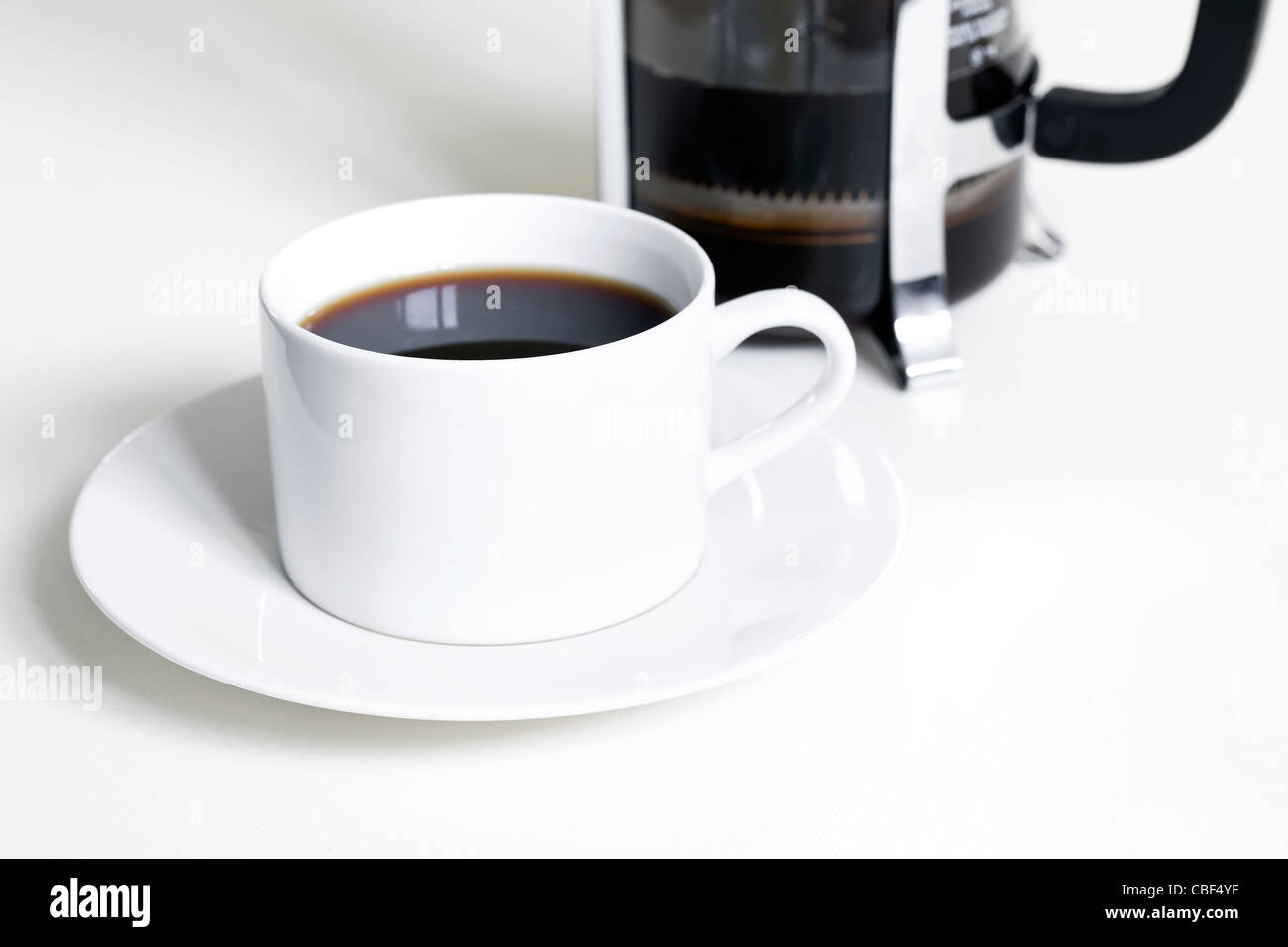 Cup of black coffee, made with French Press, white background Stock Photo