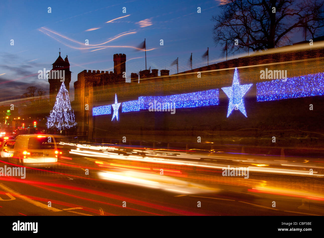 Cardiff Castle at night with Christmas lights / decorations and traffic
