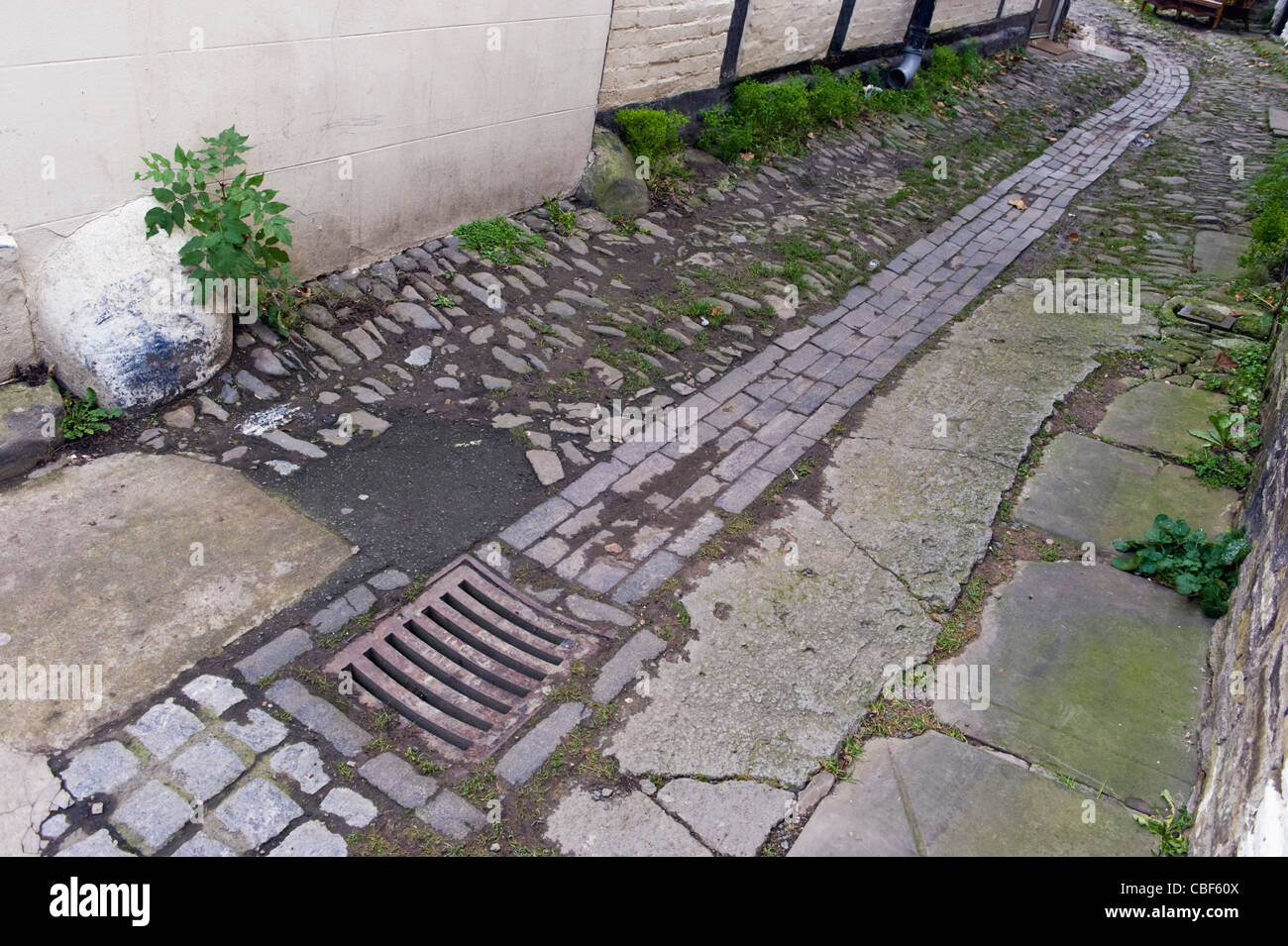 Victorian drainage system on cobbled lane in Kington Herefordshire England UK Stock Photo