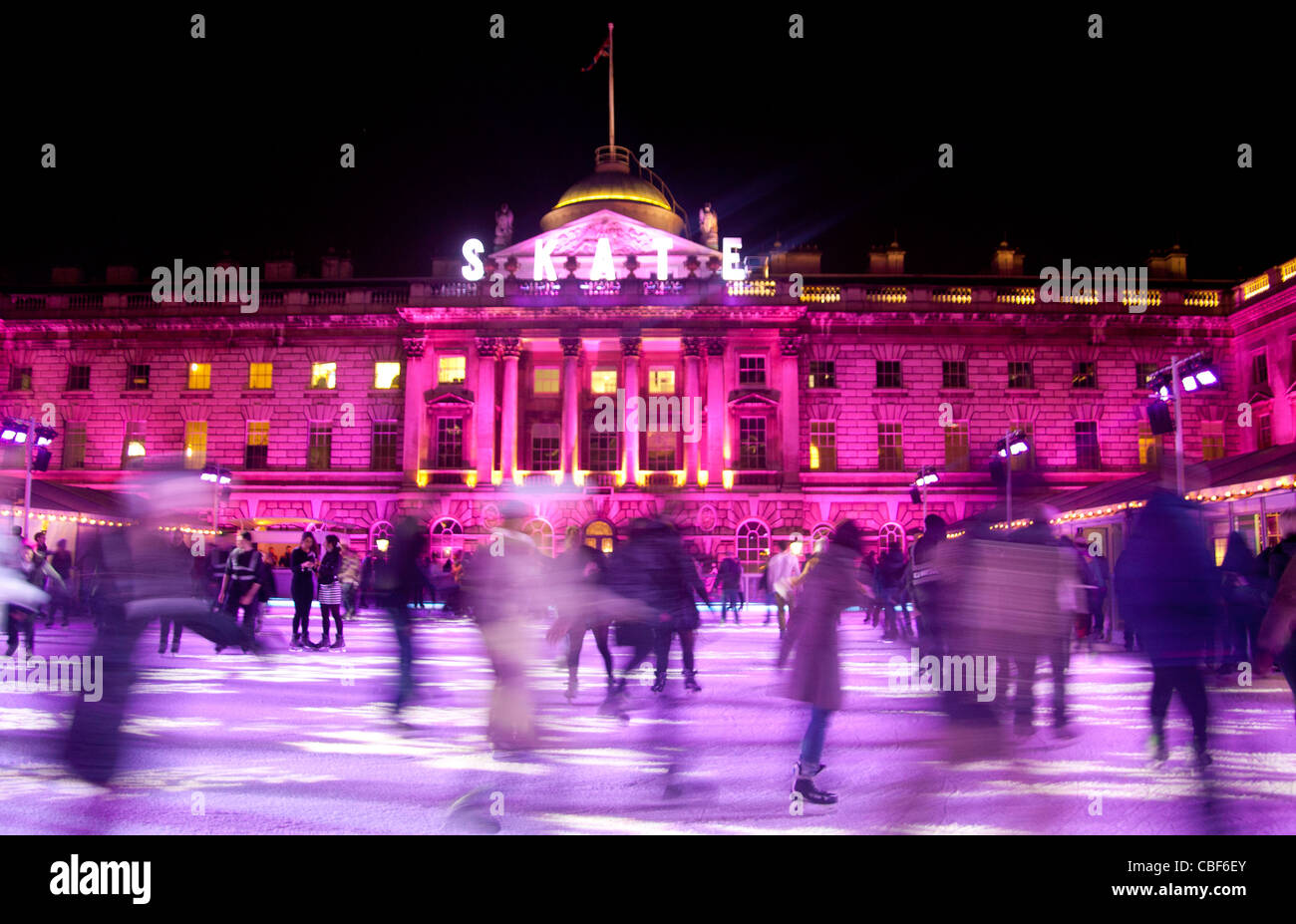 Somerset House Christmas ice rink with people skating at night December ...