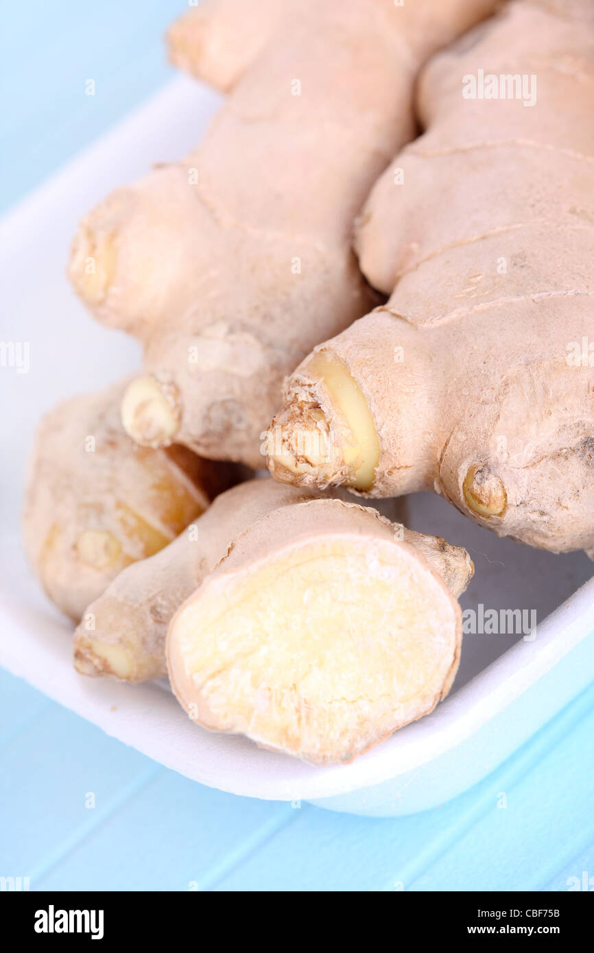 Dry ginger roots, closeup on blue Stock Photo Alamy
