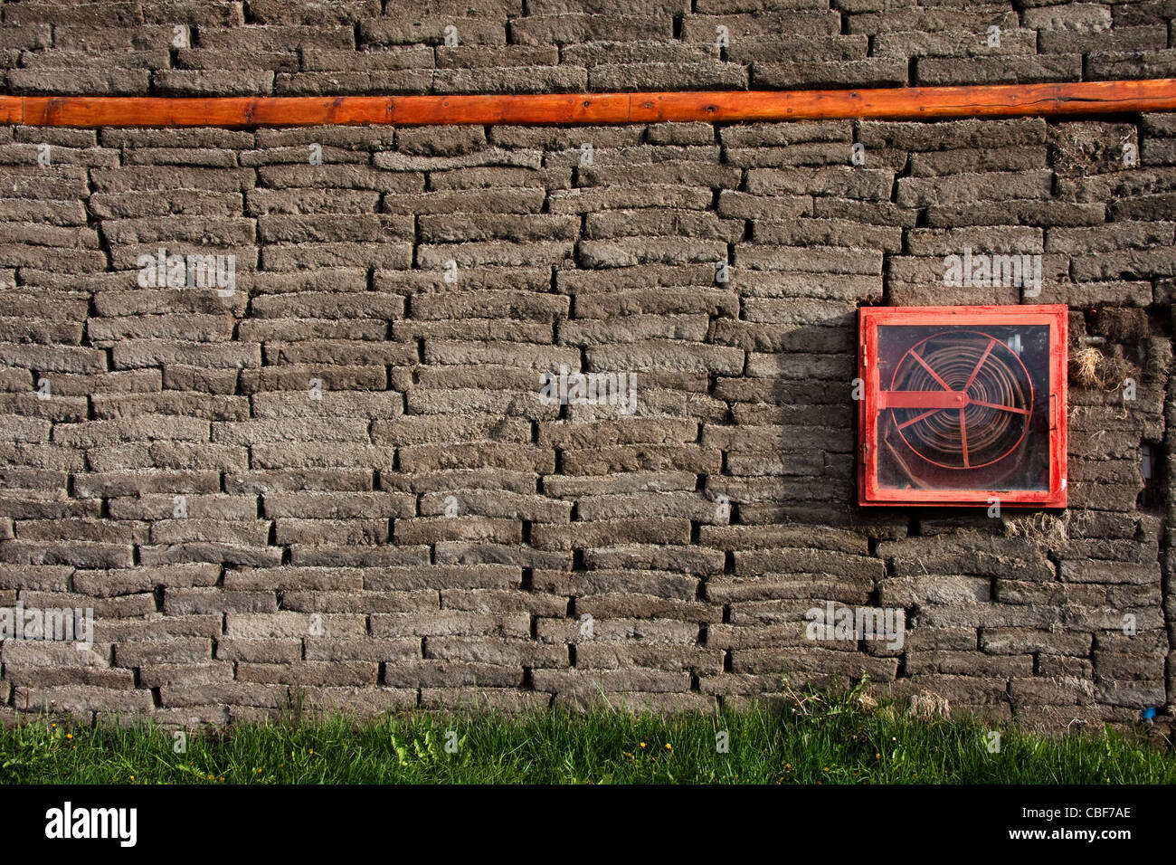 turf wall in eco building with fire hose Stock Photo