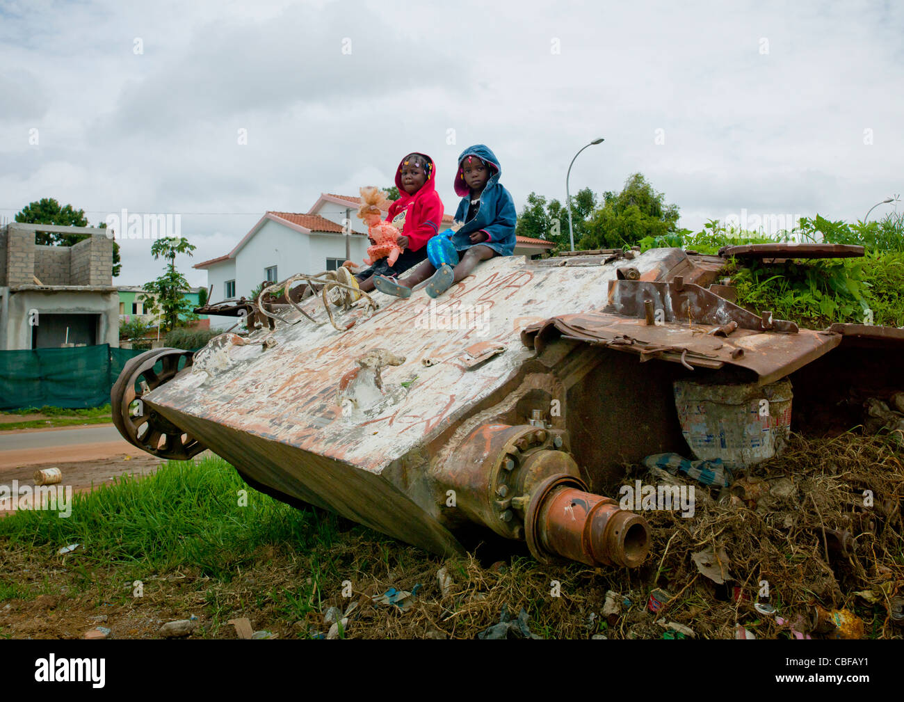 Kids On A Tank Wreck From Civil War, Angola Stock Photo