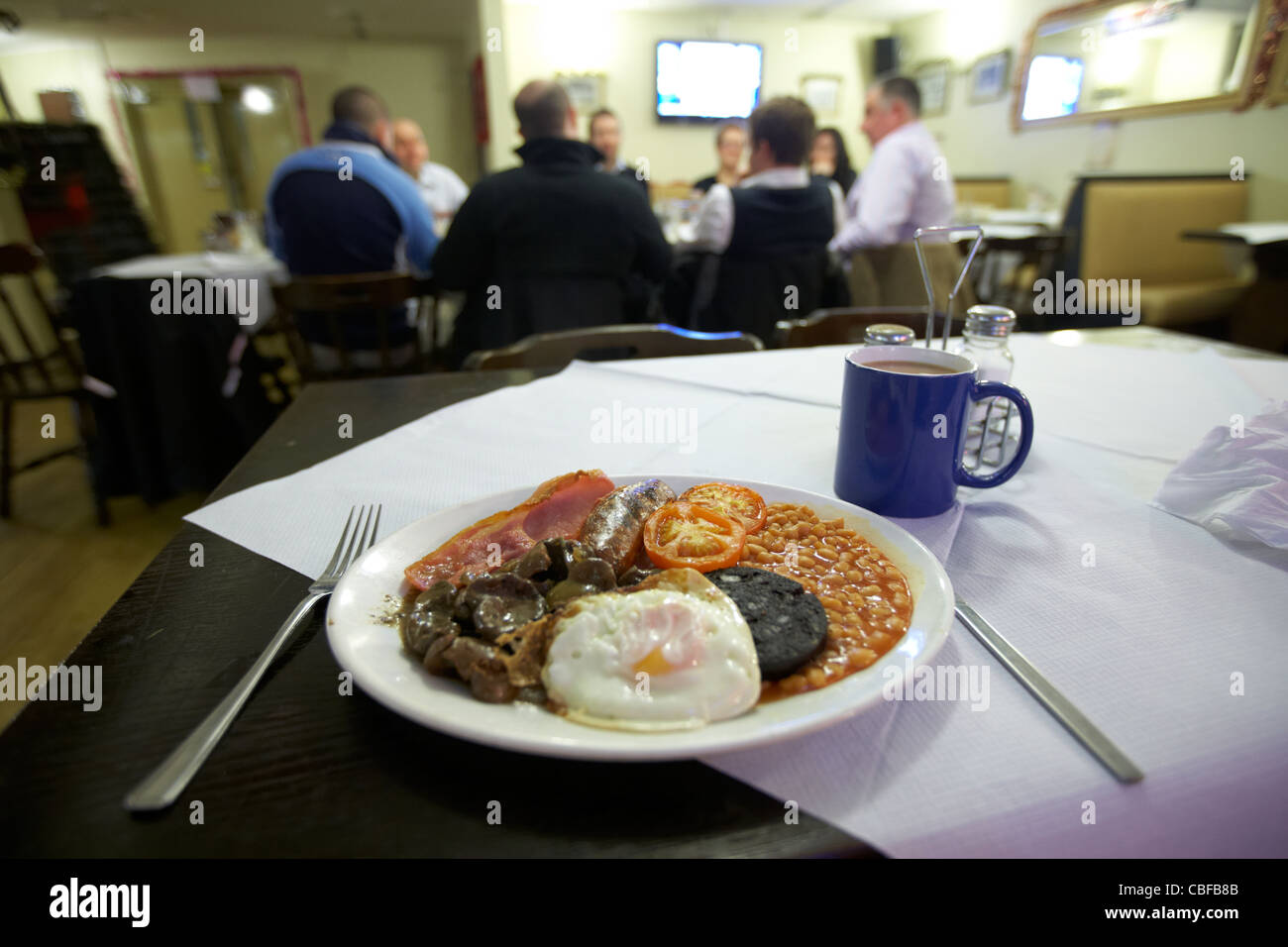 full english fried breakfast and mug of tea in a pub in london england united kingdom uk Stock Photo