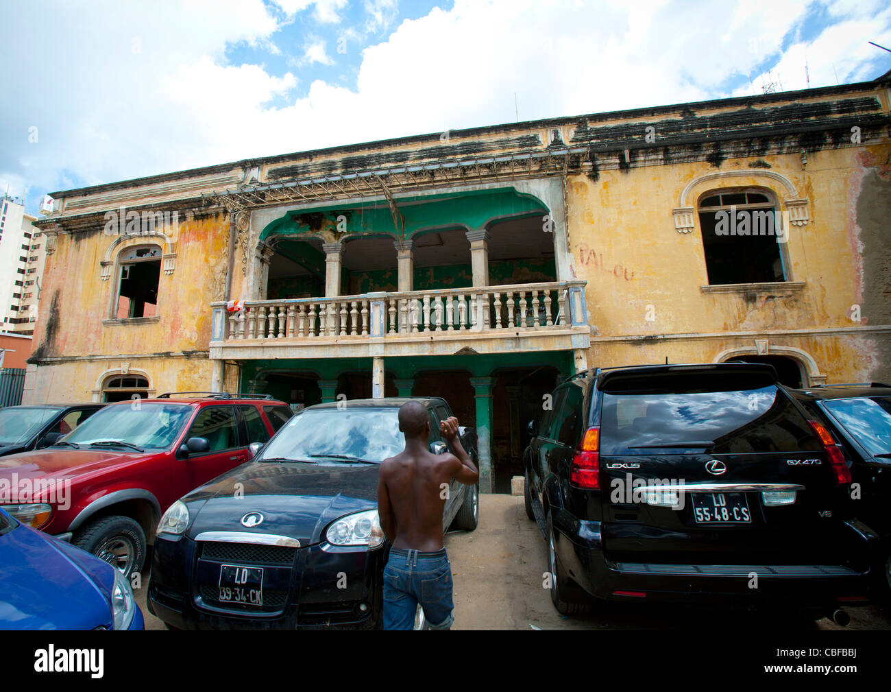 Expensive Cars Parked In Front Of The Ruins Of Grande Hotel, Luanda