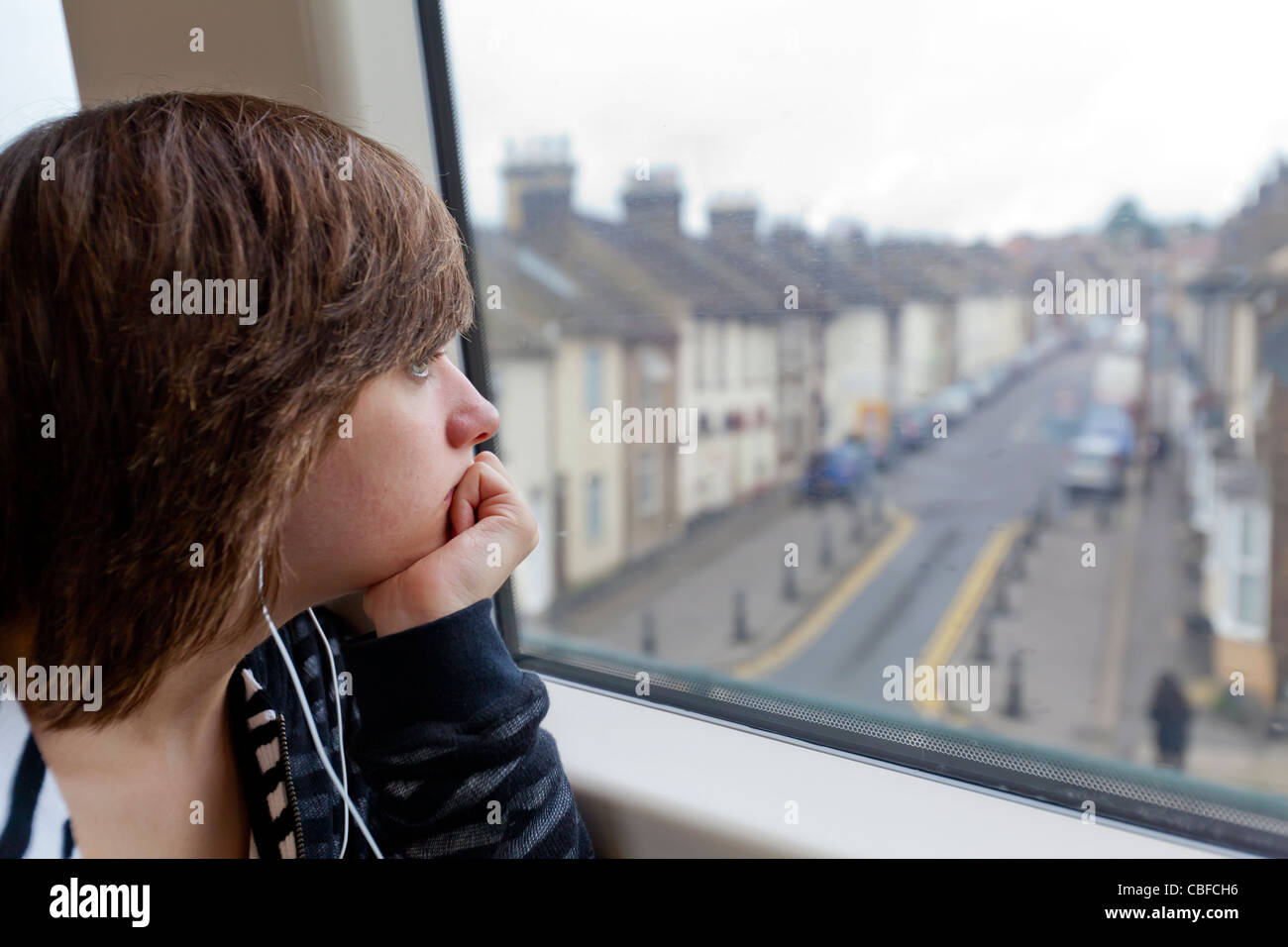 Teenage girl traveling on a train. Stock Photo
